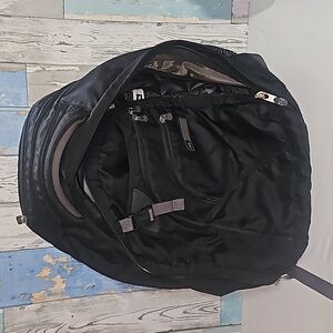 REI Travel backpack w/ multiple pockets and laptop compartment usage